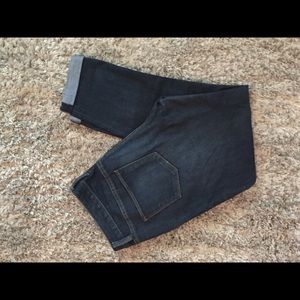 Dark wash, cropped ankle skinny jeans.